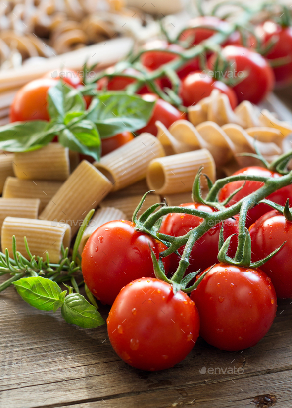 Pasta, garlic, herbs and tomatoes Stock Photo by katrinshine PhotoDune